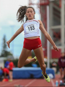 Emma Chong hurls herself into the air while competing in the long jump at the Caltaf Track Classic in Calgary on Saturday, June 20, 2015. by Aryn Toombs / Calgary Herald